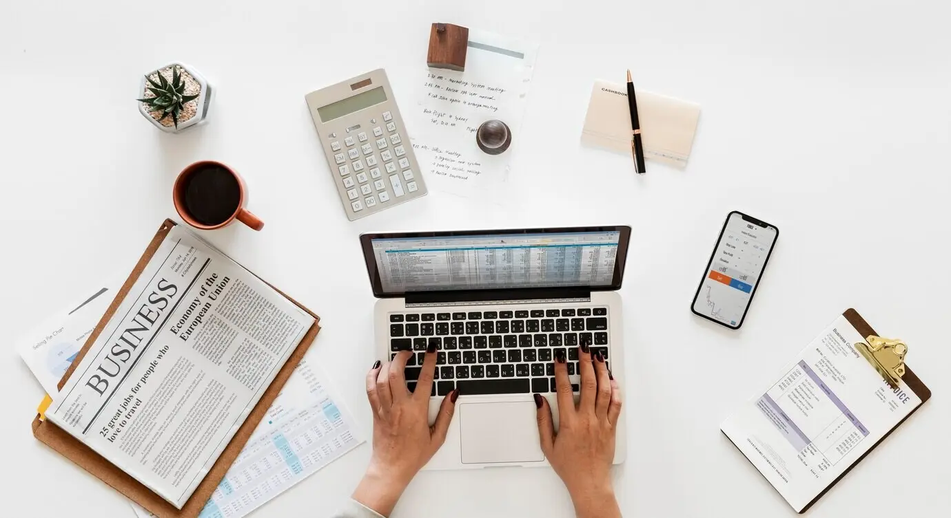 Overhead view of a businessman using a laptop computer.